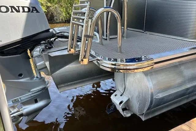 Slide: The Image of 2020 Avalon 2685 LSZ QL with Honda outboard motor docked by wooden pier. - 9