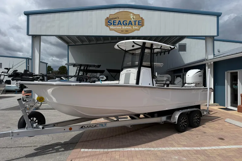 The Image of 2026 Action Craft 24 Coastal Bay boat on trailer at marine sales center. - 1