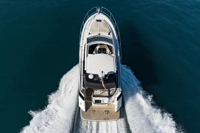 Slide: The Image of 2018 Beneteau Gran Turismo 40 cruising on open water, aerial view. - 12