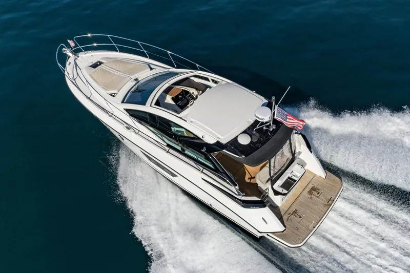 Slide: The Image of 2018 Beneteau Gran Turismo 40 yacht cruising on open water, aerial view. - 13