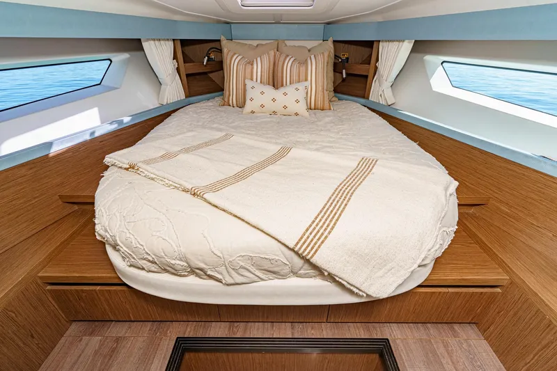 Slide: The Image of Luxurious cabin interior of 2018 Beneteau Gran Turismo 40 yacht with cozy bedding. - 18