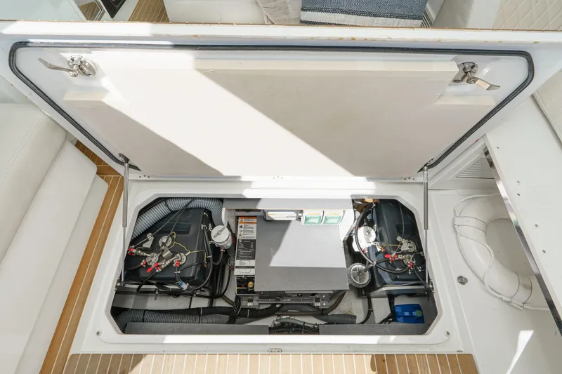 Slide: The Image of Engine compartment of 2018 Beneteau Gran Turismo 40, showcasing mechanical components and wiring. - 21