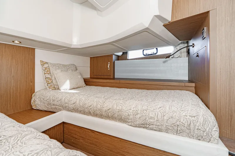 Slide: The Image of 2018 Beneteau Gran Turismo 40 cabin with twin beds and modern wood finish. - 26