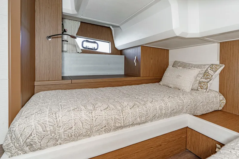 Slide: The Image of Interior cabin of 2018 Beneteau Gran Turismo 40 with cozy bed and wooden accents. - 27