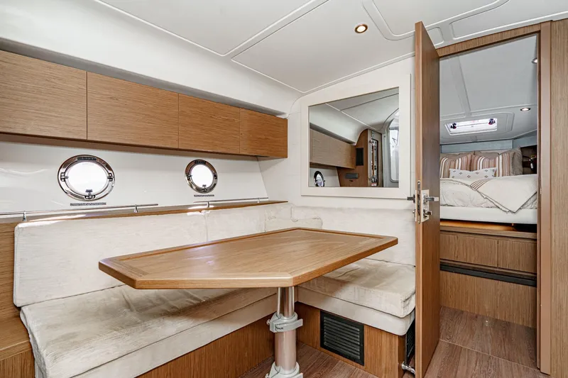 Slide: The Image of Interior of 2018 Beneteau Gran Turismo 40 yacht with cozy dining area and cabin. - 30