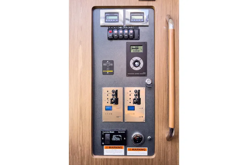 Slide: The Image of Control panel of a 2018 Beneteau Gran Turismo 40 yacht, featuring various switches and displays. - 33