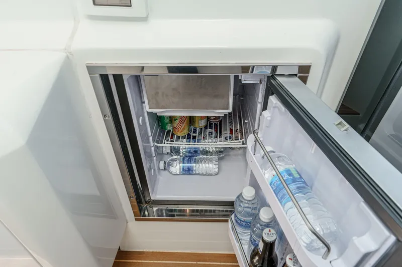 Slide: The Image of Mini fridge stocked with drinks on a 2018 Beneteau Gran Turismo 40 yacht. - 34