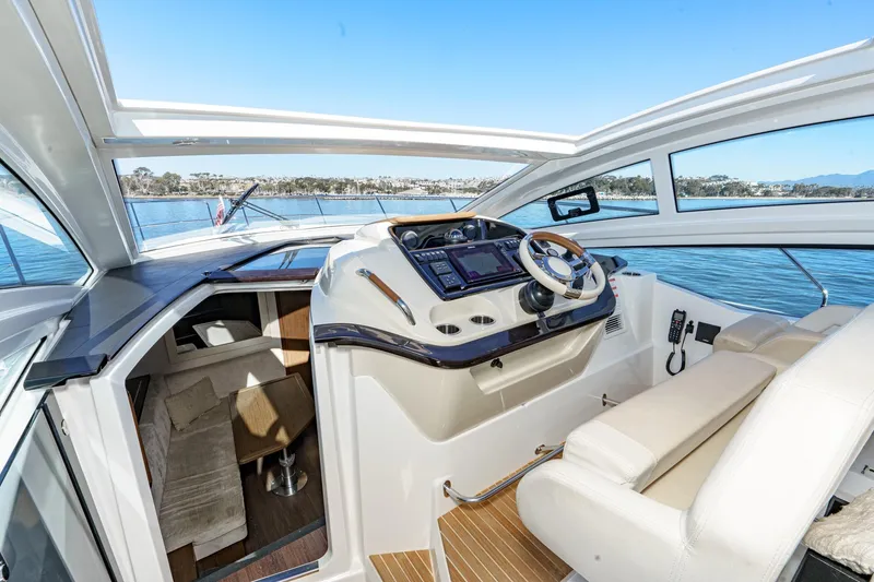 Slide: The Image of 2018 Beneteau Gran Turismo 40 yacht cockpit with modern controls and luxurious seating. - 36