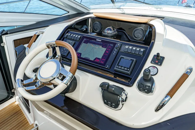 Slide: The Image of Helm of 2018 Beneteau Gran Turismo 40 with advanced navigation controls and steering wheel. - 40