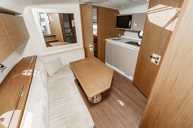 Slide: The Image of Interior of 2018 Beneteau Gran Turismo 40 yacht with modern kitchen and seating area. - 44