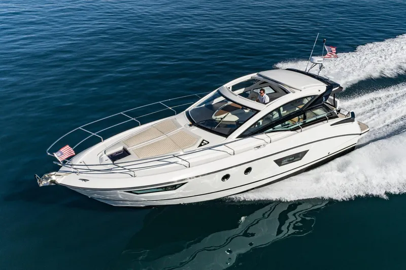 Slide: The Image of 2018 Beneteau Gran Turismo 40 yacht cruising on open water, showcasing sleek design and luxury. - 48