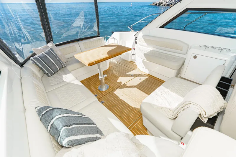 Slide: The Image of Luxurious interior of 2018 Beneteau Gran Turismo 40 yacht with elegant seating and ocean view. - 49