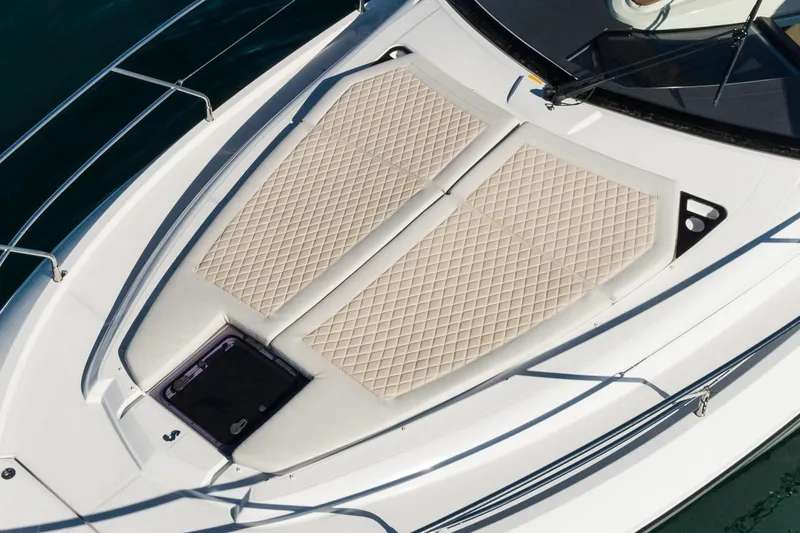 Slide: The Image of 2018 Beneteau Gran Turismo 40 yacht with beige sunbathing cushions on deck. - 55