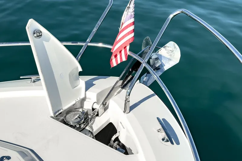 Slide: The Image of 2018 Beneteau Gran Turismo 40 yacht bow with anchor and American flag. - 58