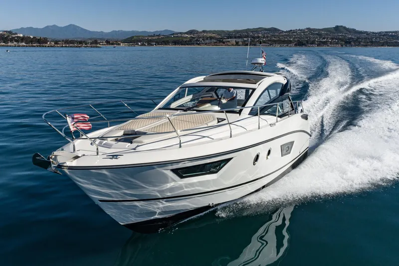 Slide: The Image of 2018 Beneteau Gran Turismo 40 yacht cruising on calm blue waters. - 59