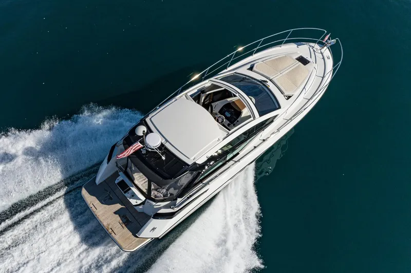 Slide: The Image of 2018 Beneteau Gran Turismo 40 yacht cruising on open water, aerial view. - 6