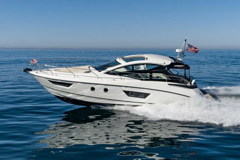 Slide: The Image of 2018 Beneteau Gran Turismo 40 yacht cruising on open water, clear blue sky. - 60