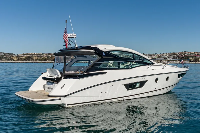 Slide: The Image of 2018 Beneteau Gran Turismo 40 yacht cruising on calm waters under clear blue skies. - 62