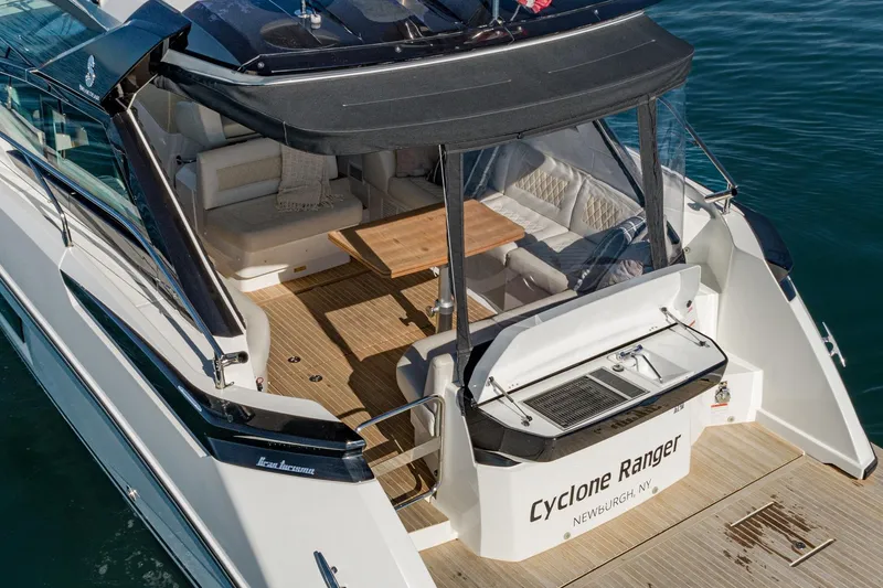 Slide: The Image of 2018 Beneteau Gran Turismo 40 yacht with spacious deck and seating area, named Cyclone Ranger. - 63