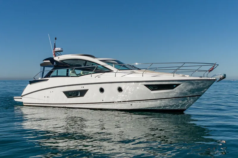 Slide: The Image of 2018 Beneteau Gran Turismo 40 yacht cruising on calm blue waters. - 65