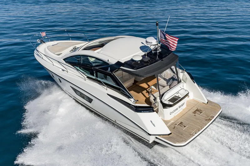 Slide: The Image of 2018 Beneteau Gran Turismo 40 yacht cruising on open water, rear view. - 66