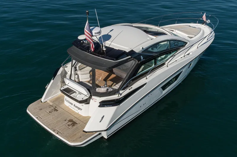 Slide: The Image of 2018 Beneteau Gran Turismo 40 yacht on calm blue water, rear view. - 71