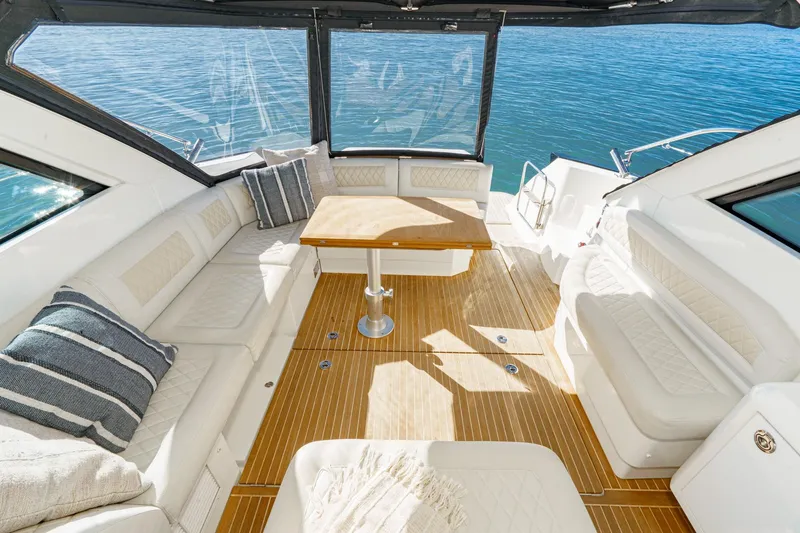 Slide: The Image of Luxurious interior of 2018 Beneteau Gran Turismo 40 yacht with elegant seating and table. - 72