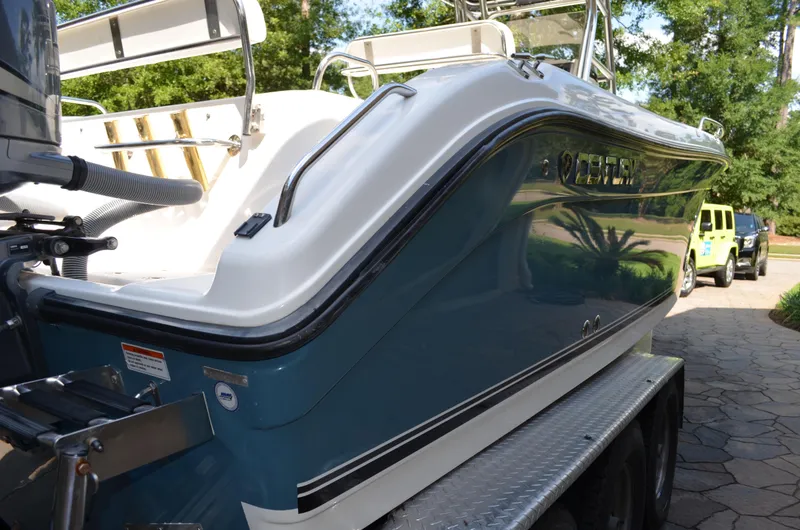 Slide: The Image of 2008 Century 2600 Center Console boat on trailer, side view. - 11