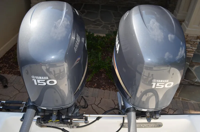 Slide: The Image of Two Yamaha 150 outboard motors on a Century 2600 Center Console boat. - 14