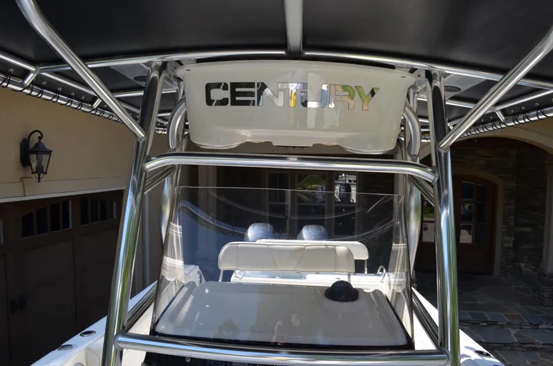 Slide: The Image of 2008 Century 2600 Center Console boat with T-top and seating area. - 23