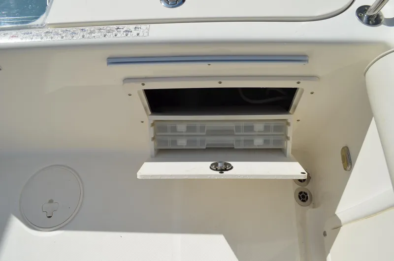 Slide: The Image of Storage compartment in 2008 Century 2600 Center Console boat. - 26