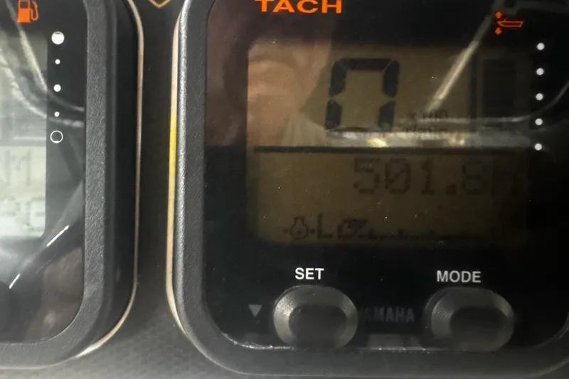 Slide: The Image of Close-up of a 2008 Century 2600 Center Console tachometer displaying 501.8 hours. - 56