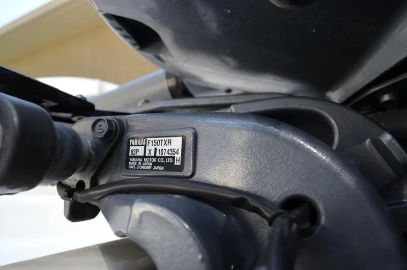 Slide: The Image of Close-up of Yamaha F150TXR outboard motor on a Century 2600 boat. - 9