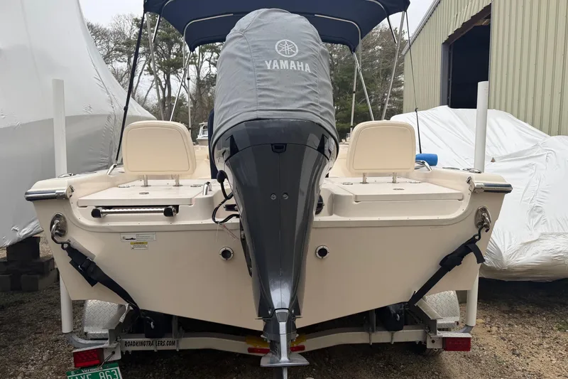 Slide: The Image of 2016 Grady-White 191 Coastal Explorer boat with Yamaha engine, parked outdoors. - 10