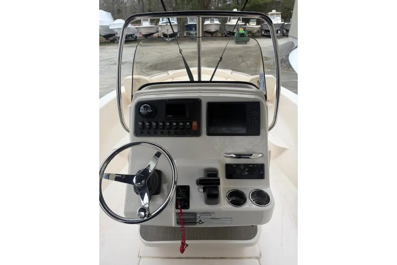 Slide: The Image of 2016 Grady-White 191 Coastal Explorer boat console with steering wheel and controls. - 3