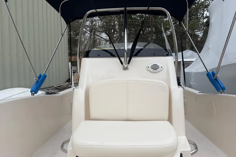 Slide: The Image of 2016 Grady-White 191 Coastal Explorer boat interior with seating and canopy. - 4