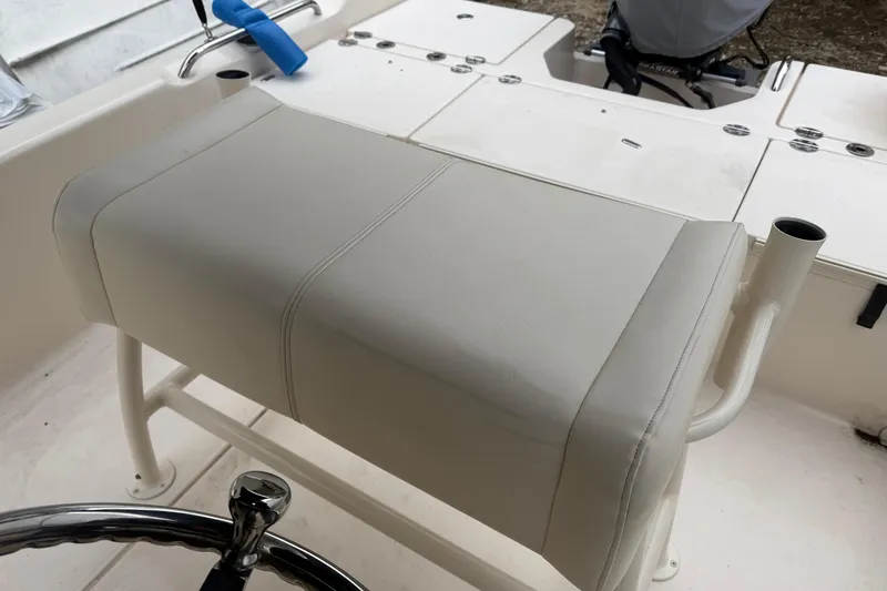Slide: The Image of 2016 Grady-White 191 Coastal Explorer boat interior with cushioned seating and steering wheel. - 6