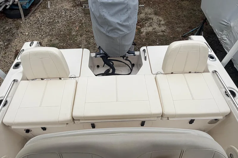 Slide: The Image of 2016 Grady-White 191 Coastal Explorer boat seating and engine area. - 8