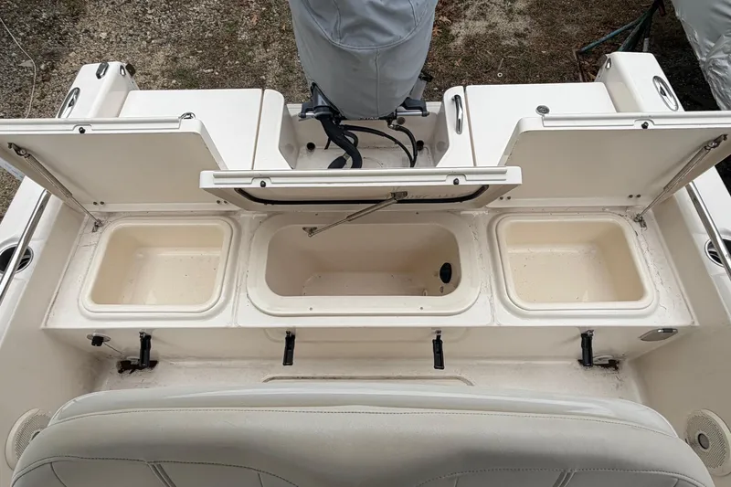 Slide: The Image of 2016 Grady-White 191 Coastal Explorer boat with open storage compartments and seating. - 9