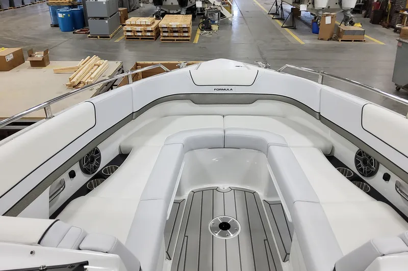 Slide: The Image of 2026 Formula 310 Bowrider OB interior with spacious seating and modern design in a workshop setting. - 11