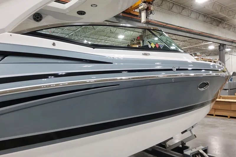 Slide: The Image of 2026 Formula 310 Bowrider OB in a showroom, showcasing sleek design and modern features. - 4