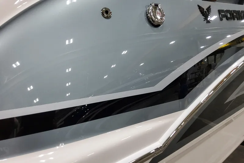 Slide: The Image of 2026 Formula 310 Bowrider OB boat with sleek design and glossy finish. - 9