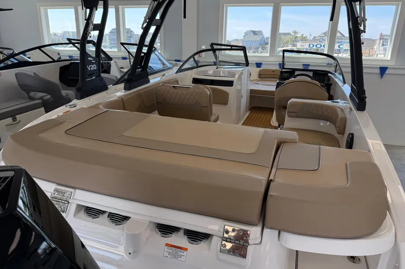 Slide: The Image of 2026 Bayliner VR6 Bowrider OB with spacious seating in a showroom setting. - 3