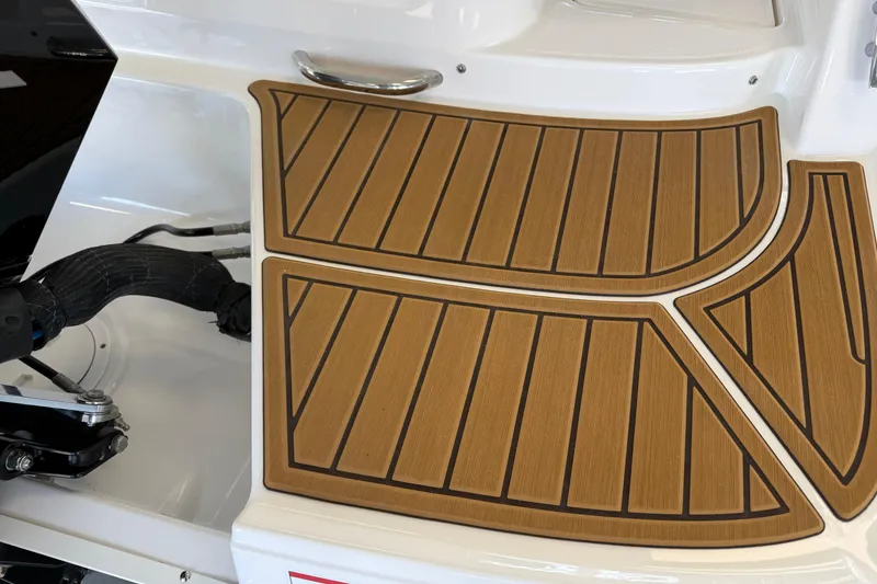 Slide: The Image of 2026 Bayliner VR6 Bowrider OB deck with teak-style flooring detail. - 4