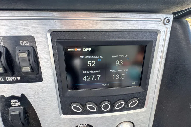 Slide: The Image of Dashboard of a 2017 MasterCraft NXT22 showing engine metrics and controls. - 13