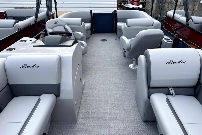 Slide: The Image of 2026 Bentley Pontoons Legacy 220 Navigator interior with luxurious seating and modern design. - 10