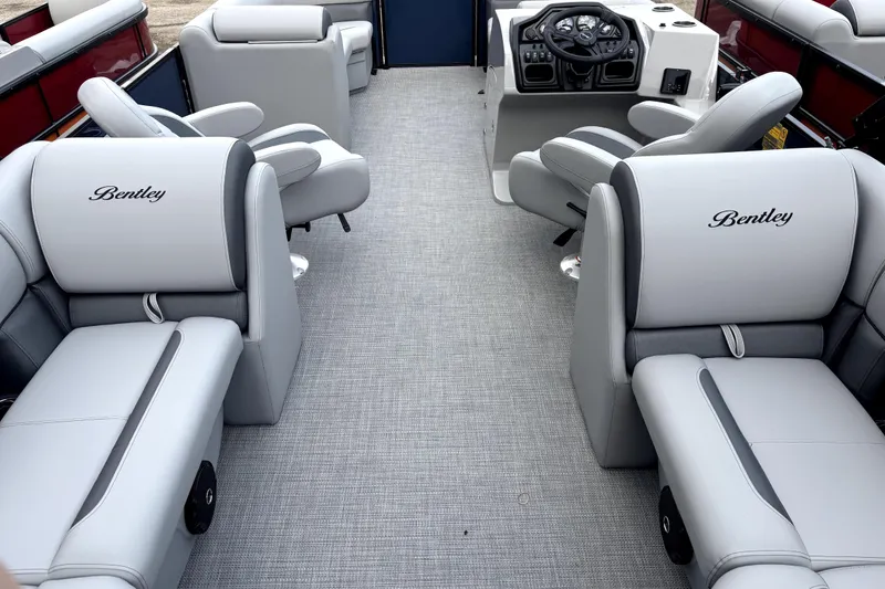 Slide: The Image of 2026 Bentley Pontoons Legacy 220 Navigator interior with luxurious seating and modern helm. - 3
