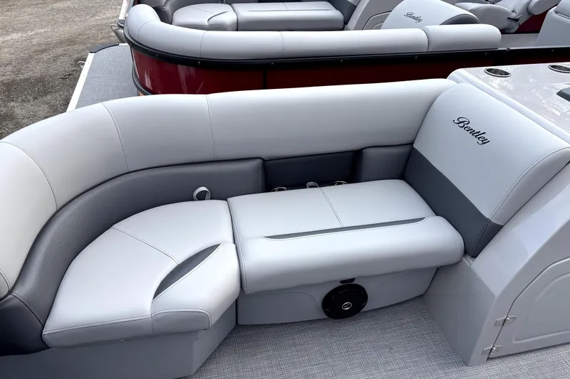 Slide: The Image of 2026 Bentley Pontoons Legacy 220 Navigator interior with luxurious seating and elegant design. - 9