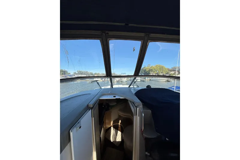 Slide: The Image of Interior view of 2000 Bayliner 3055 Ciera Sunbridge DX/LX boat with open cabin door. - 3