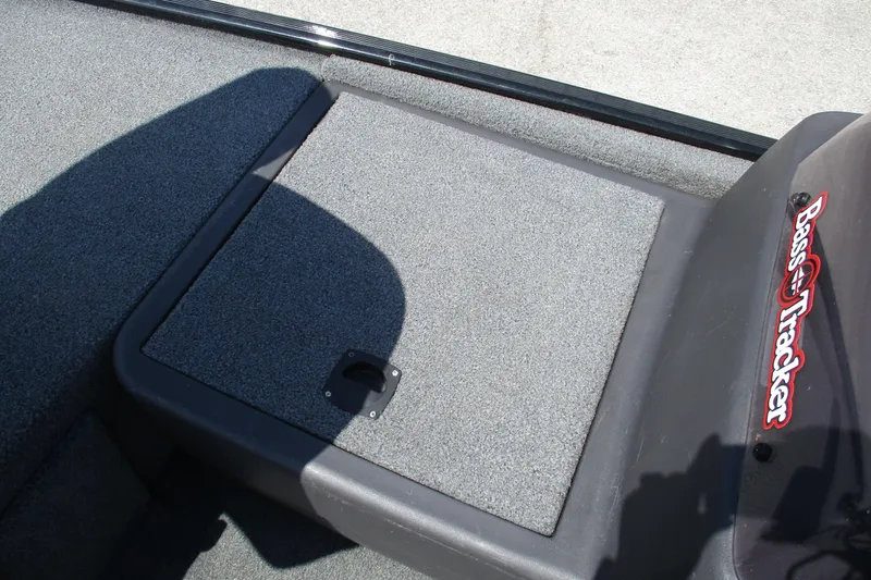 Slide: The Image of 2022 Tracker Bass Tracker Classic XL boat interior with carpeted storage compartment. - 10